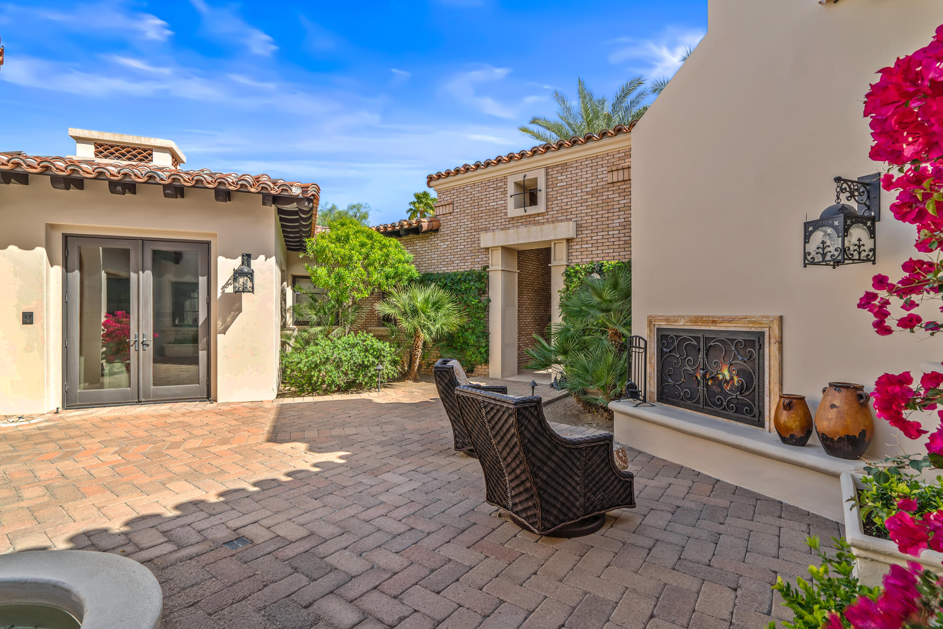 31 Hillcrest Drive Rancho Mirage, CA 92270 - Photo 16 of 82 a view of a patio with couches table and chairs and potted plants