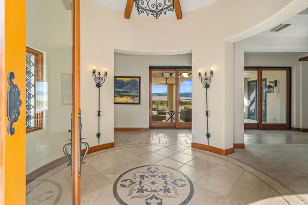 a open kitchen with stainless steel appliances granite countertop a stove and a view of living room