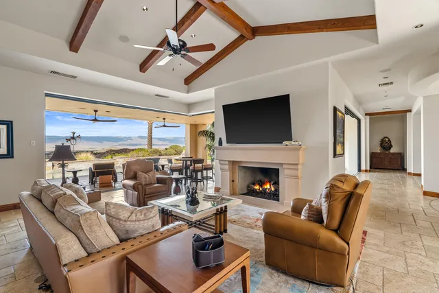 a dinning area with chairs and kitchen view