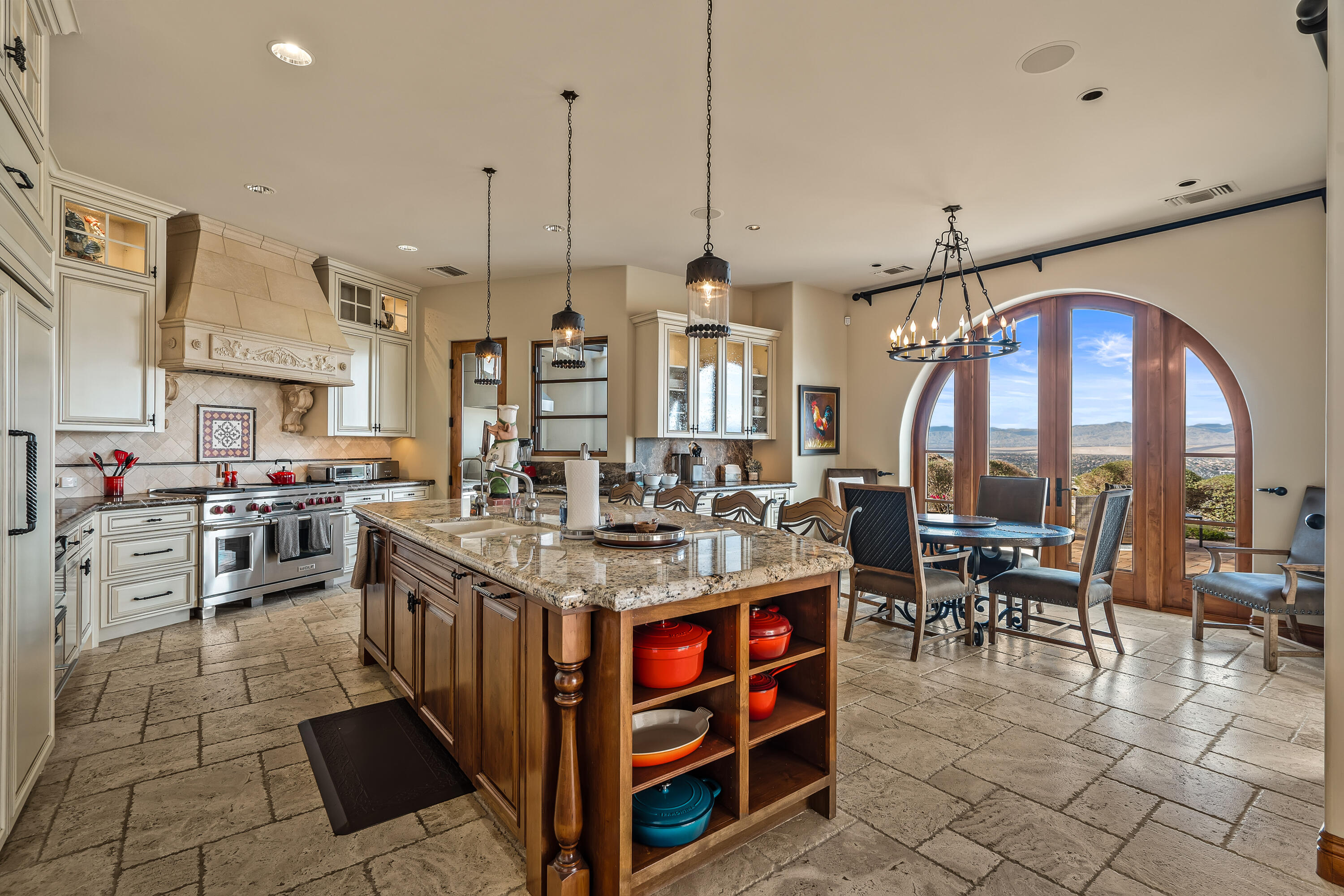 31 Hillcrest Drive Rancho Mirage, CA 92270 - Photo 27 of 82 a open kitchen with stainless steel appliances granite countertop a stove and a view of living room