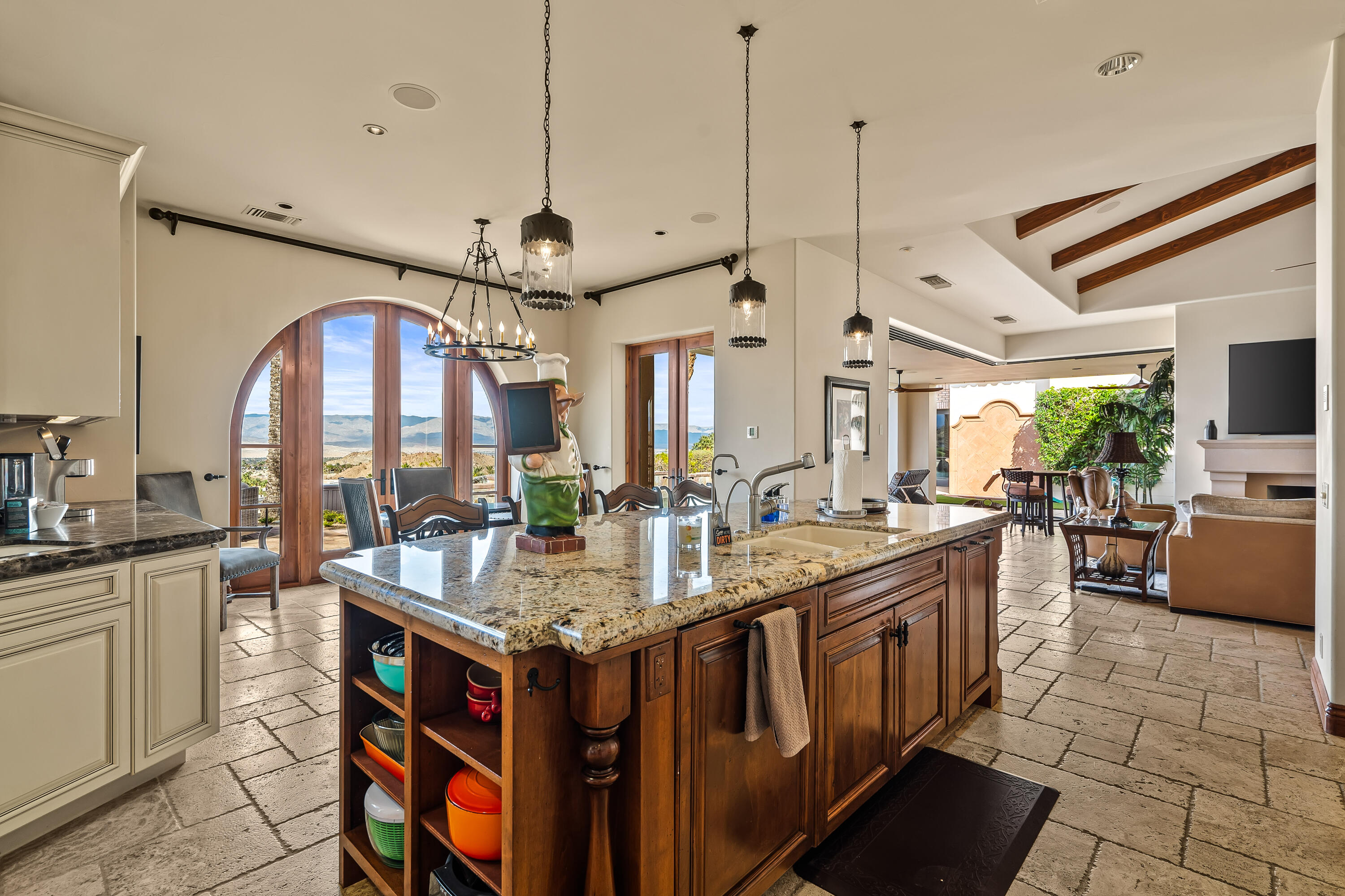 31 Hillcrest Drive Rancho Mirage, CA 92270 - Photo 30 of 82 a very nice looking kitchen with granite countertop a sink stove and cabinets