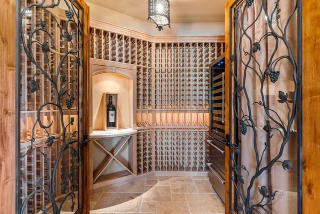 a spacious bedroom with a bed and a large window