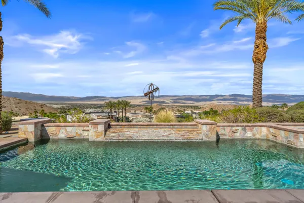 a view of a swimming pool with an ocean view