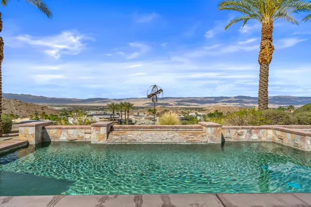 a view of a swimming pool with an ocean view