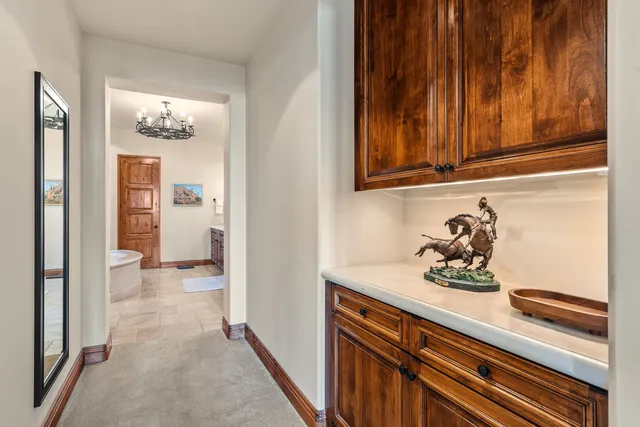 a view of a swimming pool with a table and chairs