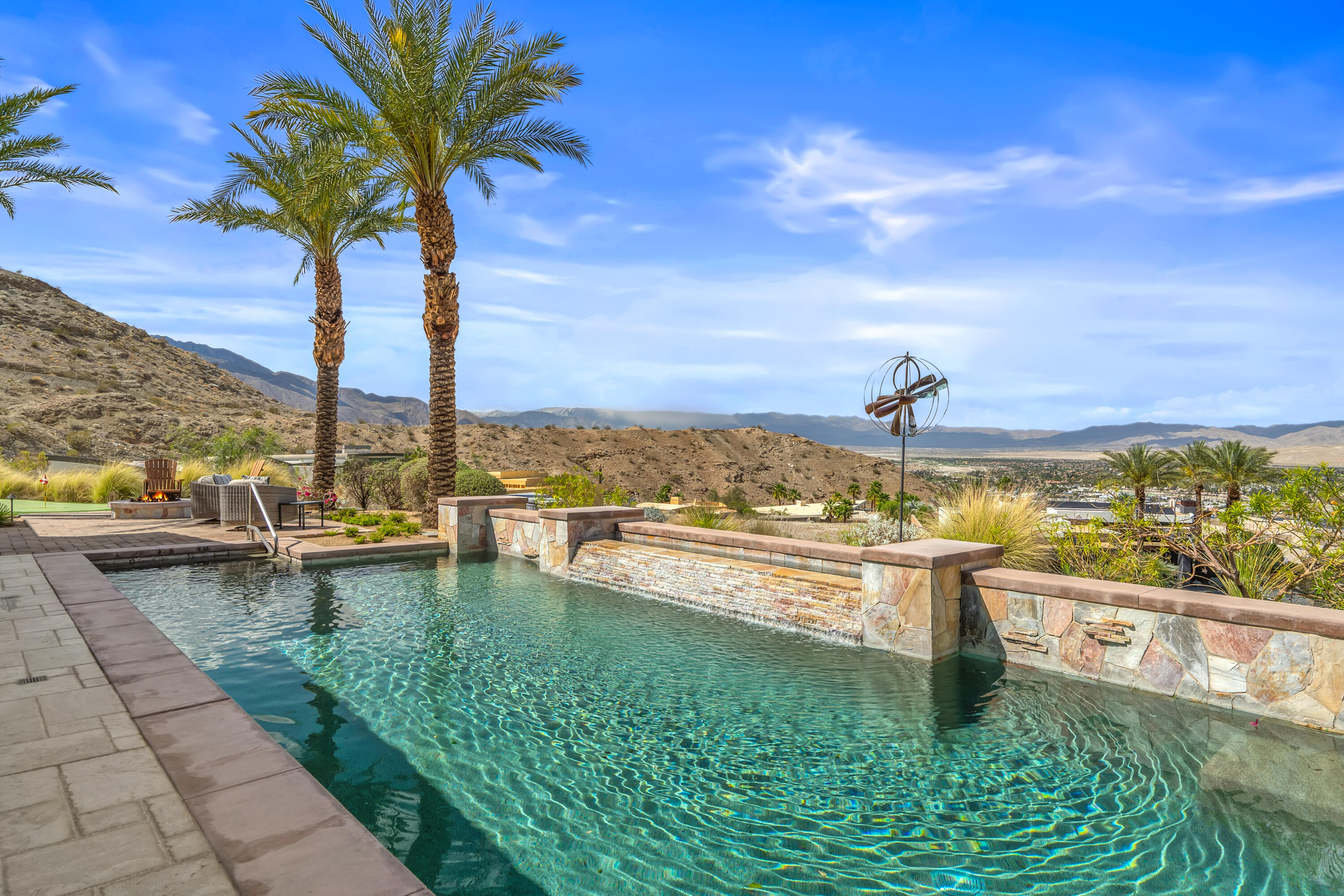 31 Hillcrest Drive Rancho Mirage, CA 92270 - Photo 5 of 82 a view of a swimming pool with an ocean view