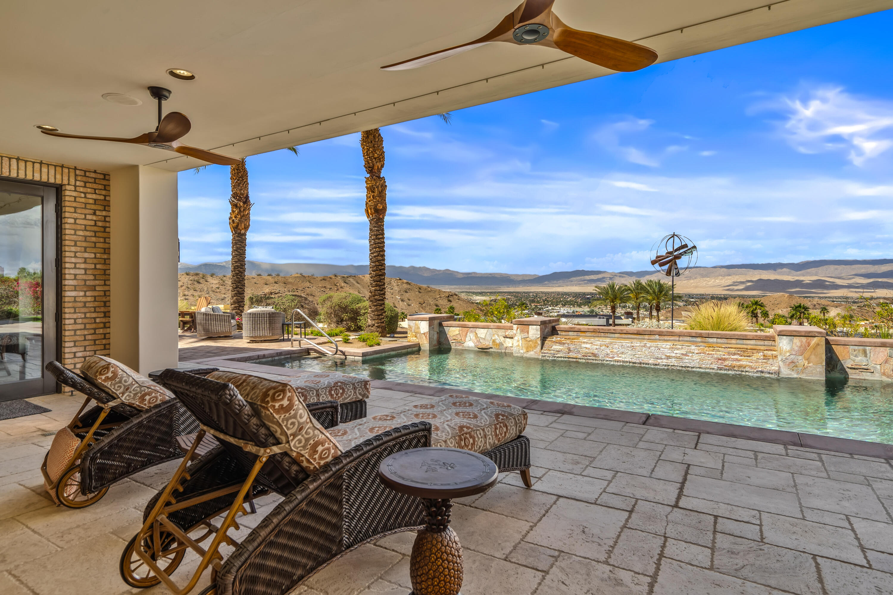 31 Hillcrest Drive Rancho Mirage, CA 92270 - Photo 60 of 82 a view of a livingroom with furniture and floor to ceiling window