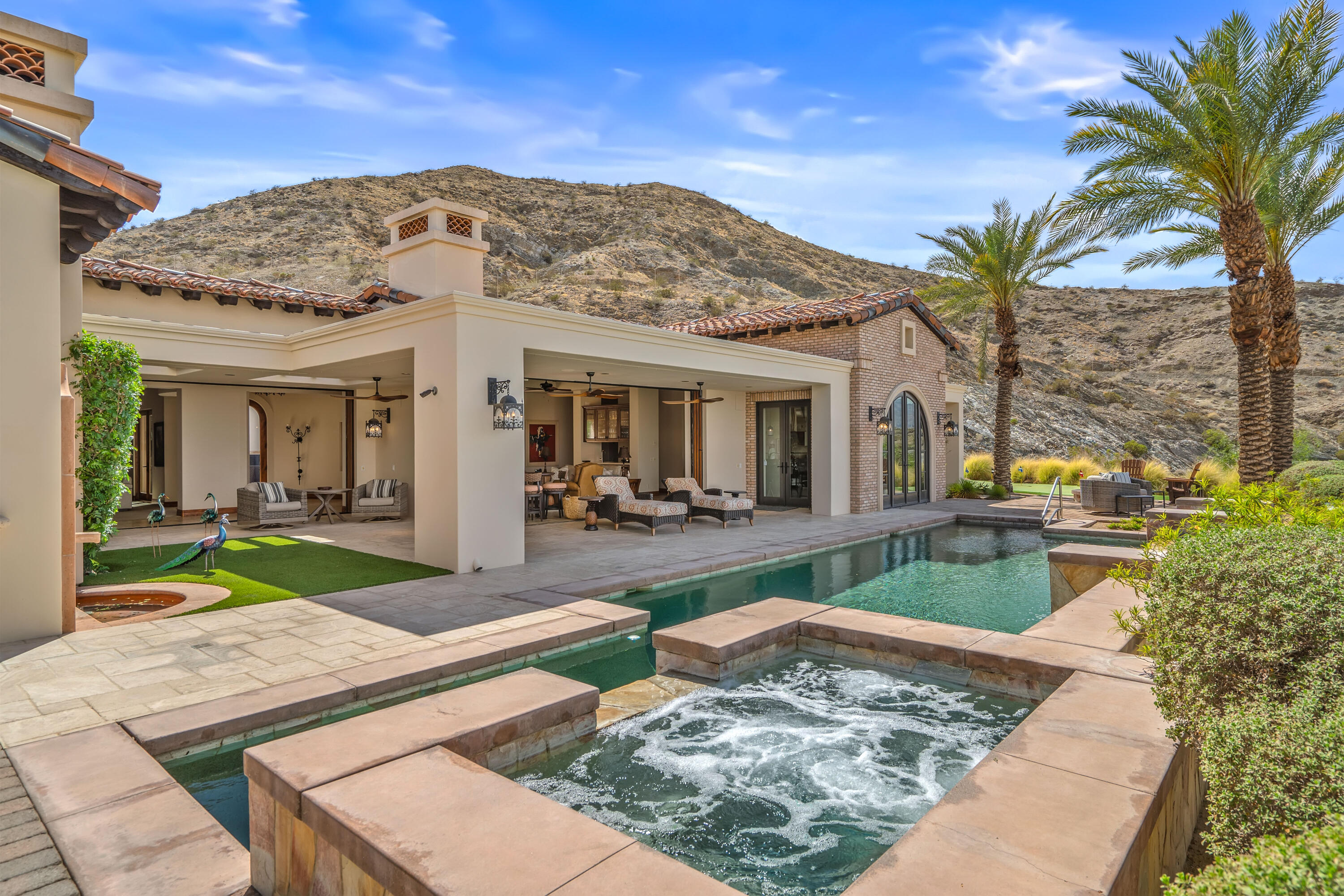 31 Hillcrest Drive Rancho Mirage, CA 92270 - Photo 68 of 82 a view of a house with backyard porch and sitting area