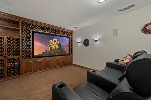 a view of a patio with couches table and chairs and potted plants