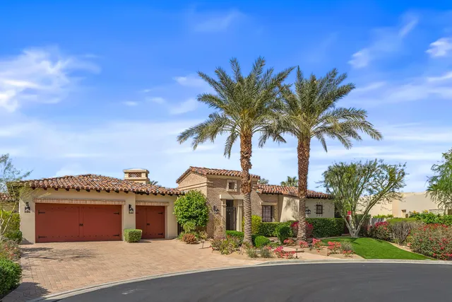 a living room with furniture a rug and a large window