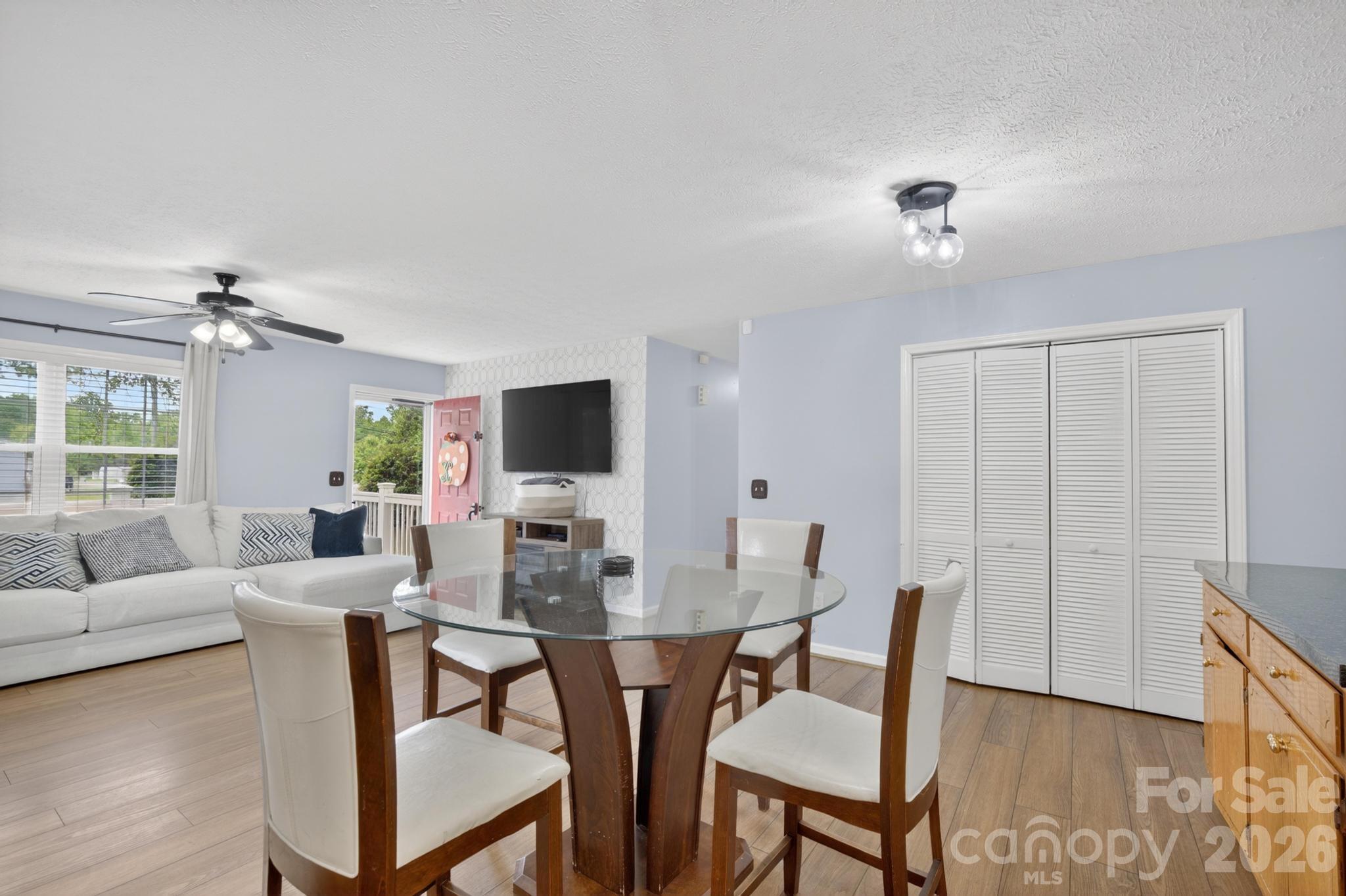 2308 Walt Arney Road Lenoir, NC 28645 - Photo 35 of 37 a view of a dining room with furniture and wooden floor