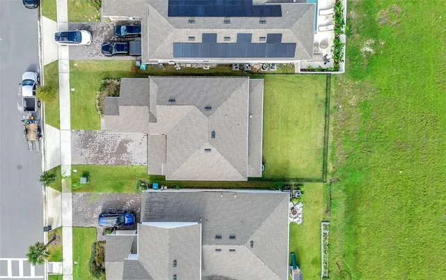aerial view of a house with a yard