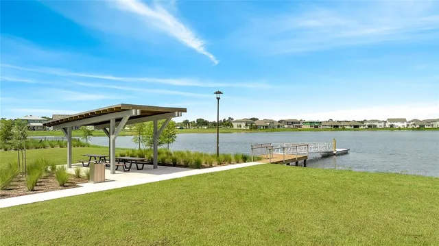 a view of a swimming pool with a table and chairs