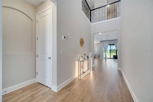 a view of hallway with wooden floor