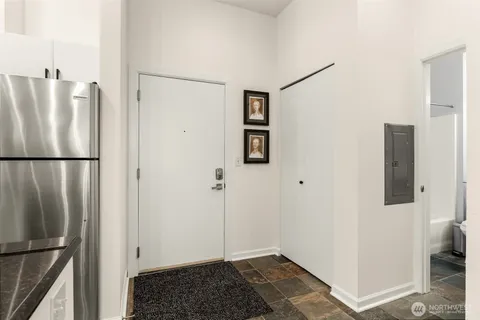 a view of a bathroom with a sink and a mirror
