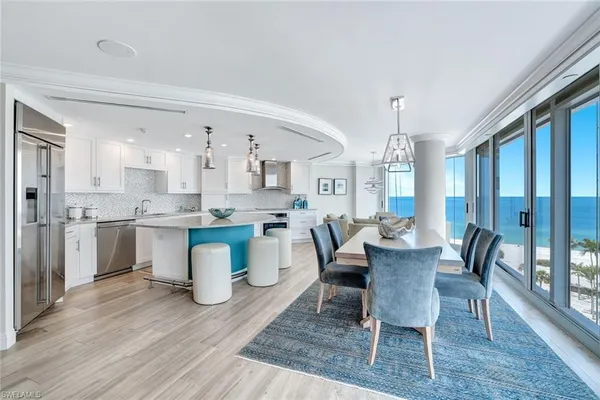 a view of a dining room with furniture and wooden floor