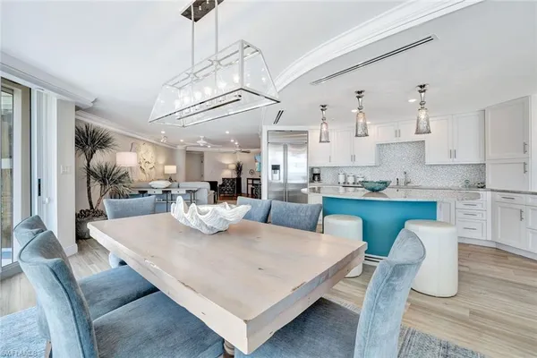 a view of kitchen with dining table and chairs