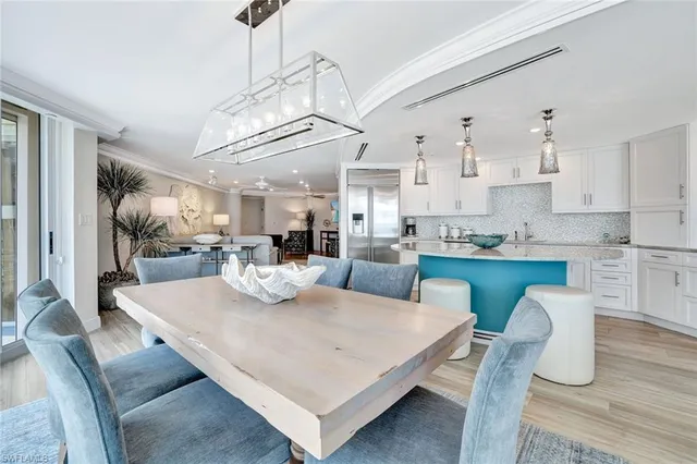 a view of kitchen with dining table and chairs