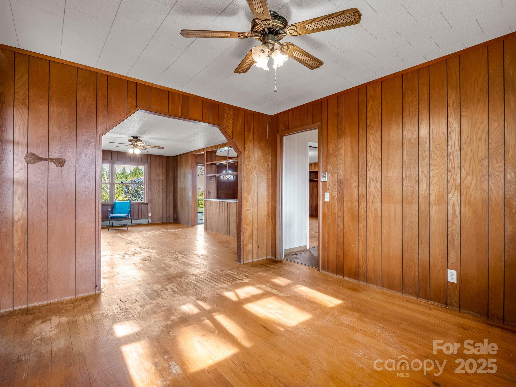 6 Rachel Bell Road Mill Spring, NC 28756 - Photo 15 of 39 a view of a livingroom with a chandelier fan