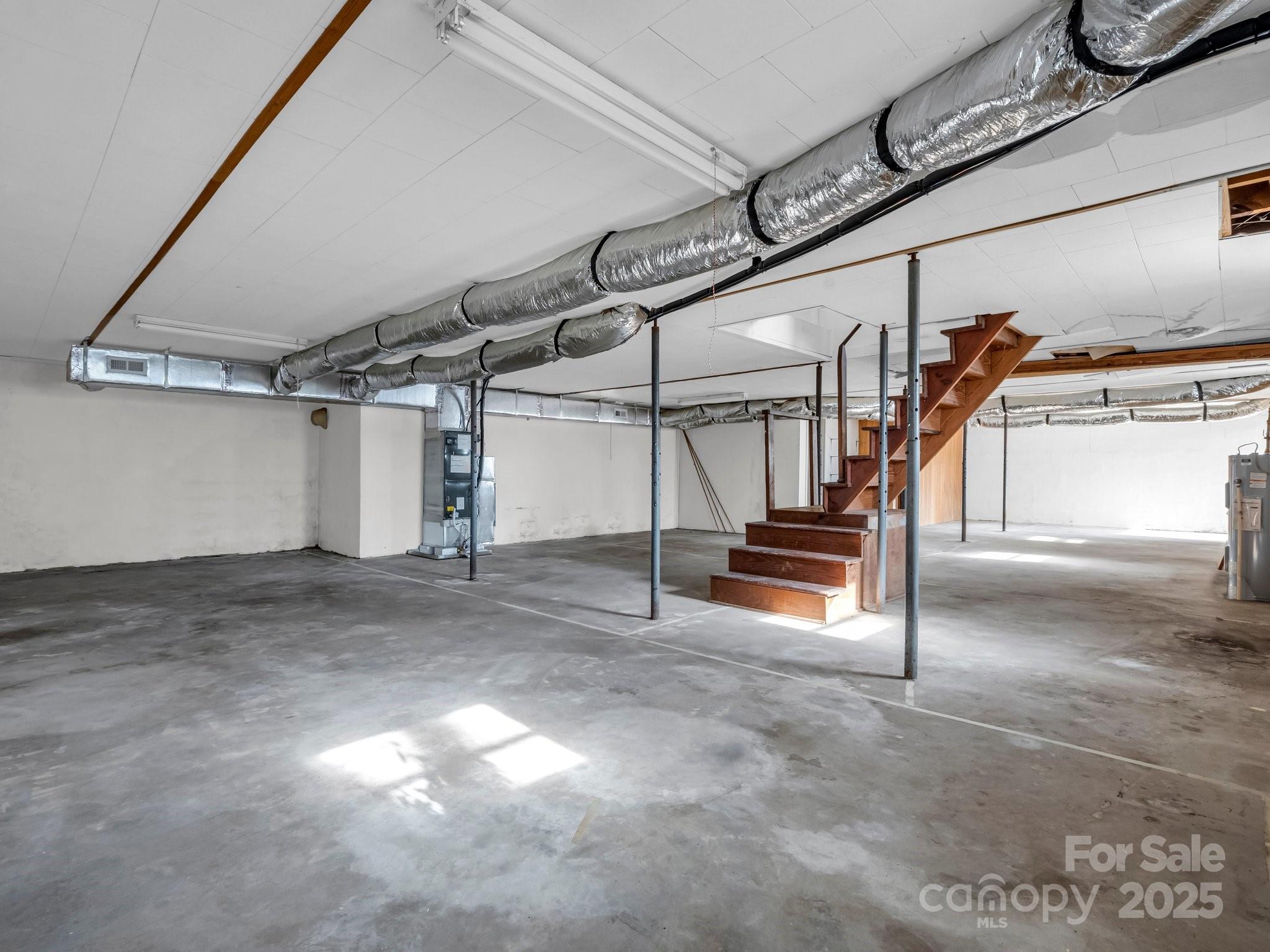 6 Rachel Bell Road Mill Spring, NC 28756 - Photo 27 of 39 a view of an empty room with stairs