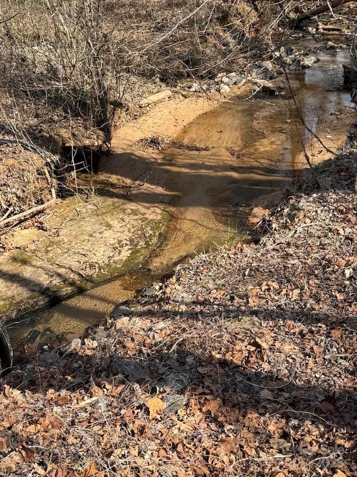 6 Rachel Bell Road Mill Spring, NC 28756 - Photo 3 of 39 a view of a yard with wooden fence