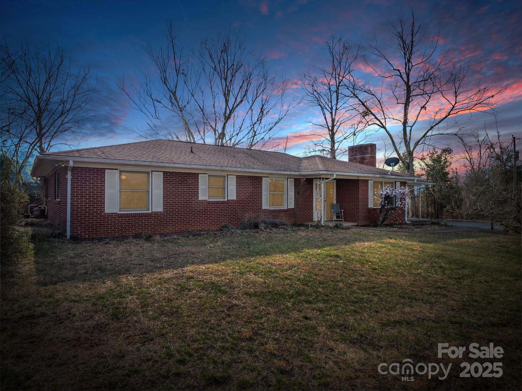 6 Rachel Bell Road Mill Spring, NC 28756 - Photo 6 of 39 a view of a yard in front of a house with large trees