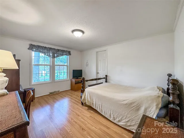 a bedroom with a bed and a table in it