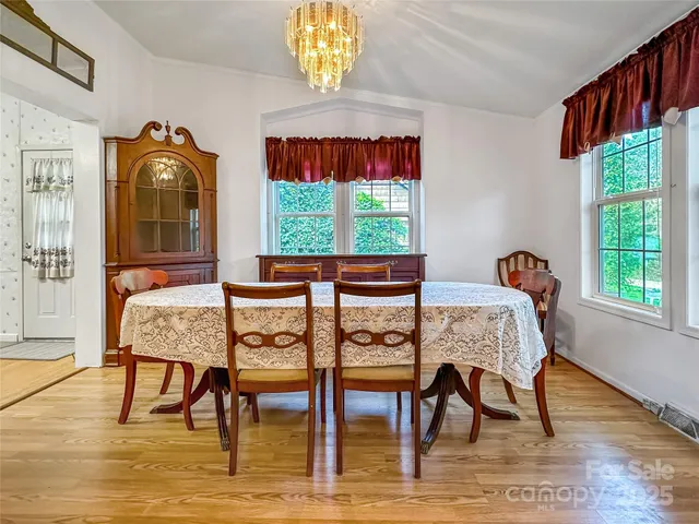 a dining room with furniture and window