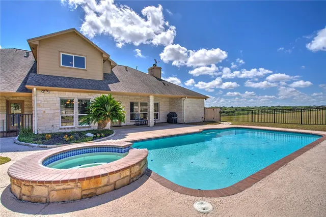 a view of a house with swimming pool
