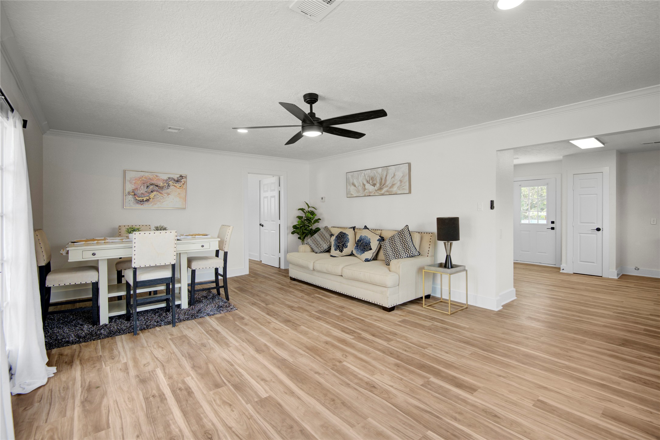 4909 Cochran Street, Unit 12 Houston, TX 77009 - Photo 12 of 29 a living room with furniture and wooden floor