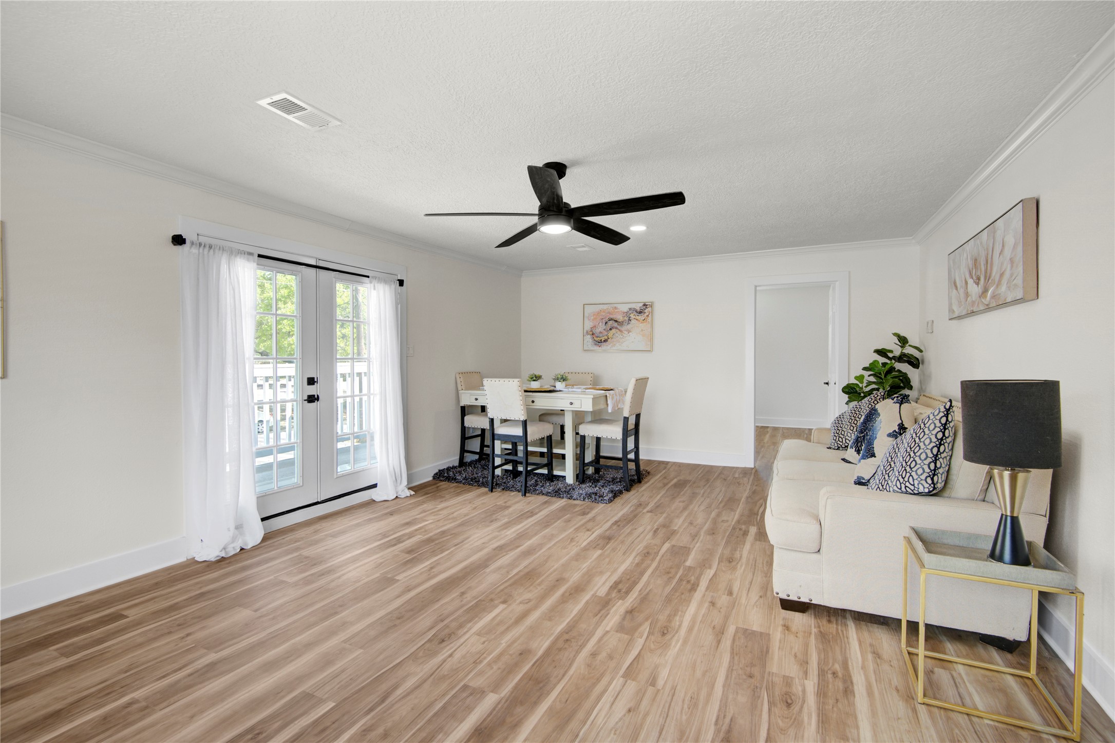 4909 Cochran Street, Unit 12 Houston, TX 77009 - Photo 13 of 29 a living room with furniture and wooden floor