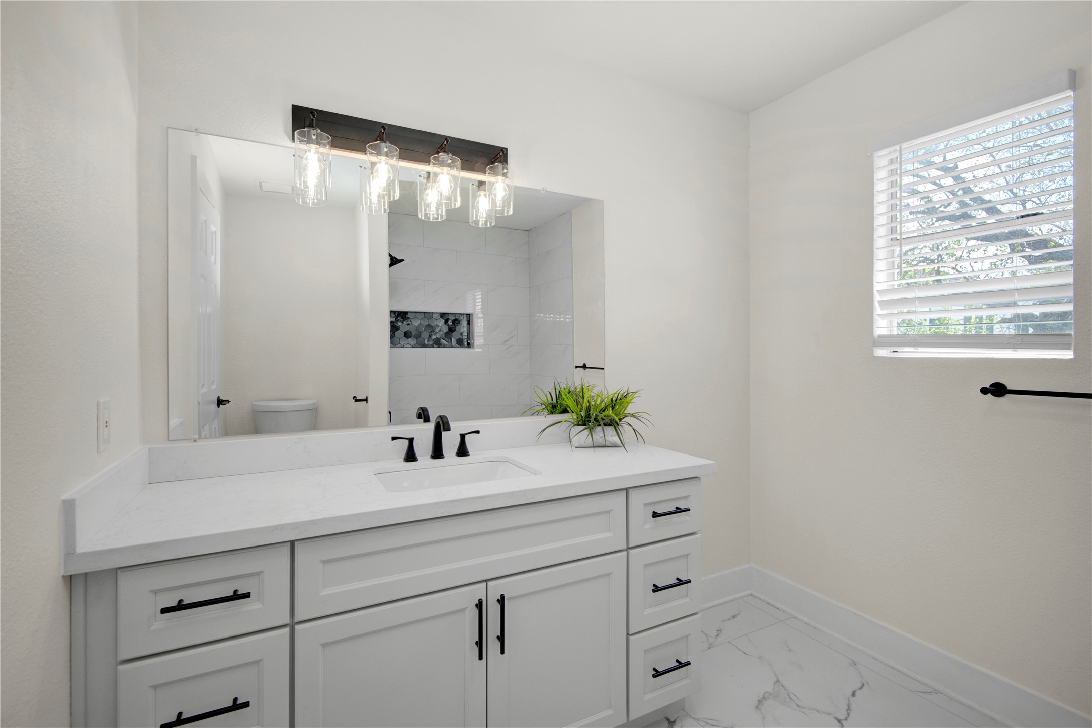 4909 Cochran Street, Unit 12 Houston, TX 77009 - Photo 17 of 29 a bathroom with a sink and a mirror