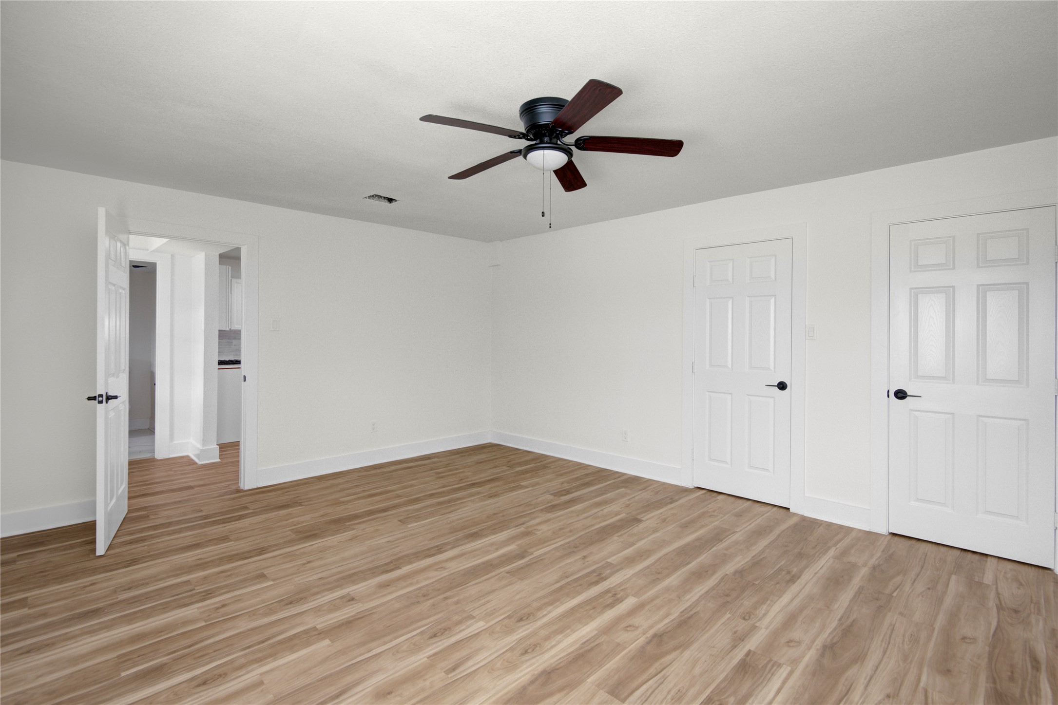 4909 Cochran Street, Unit 12 Houston, TX 77009 - Photo 19 of 29 a view of empty room with wooden floor