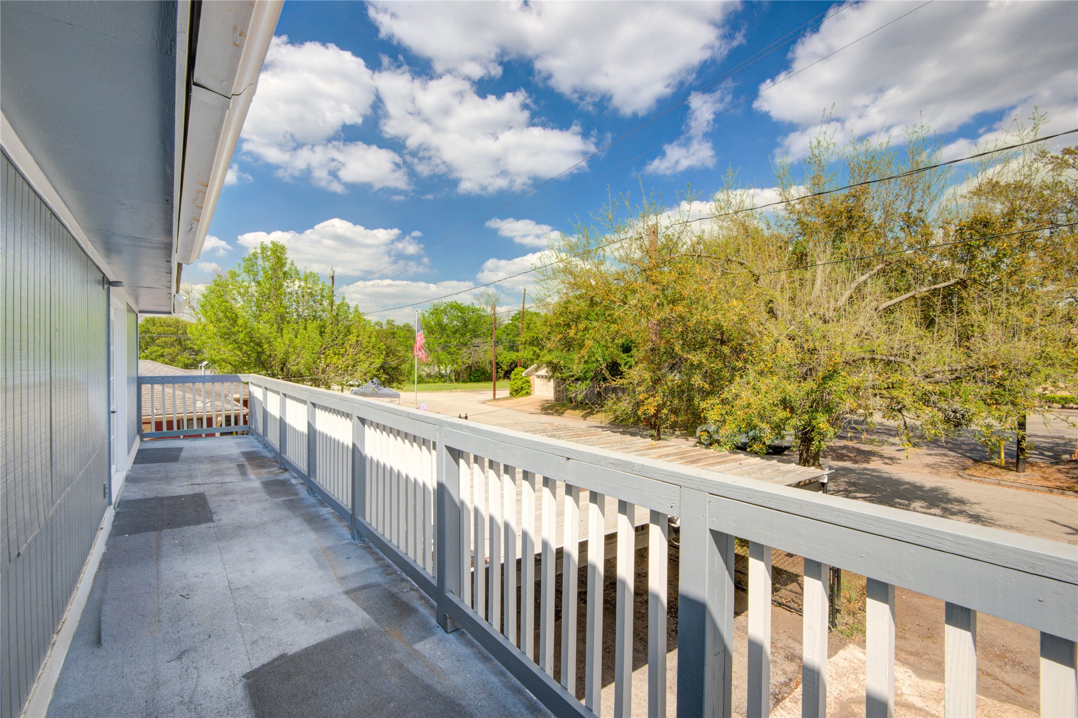 4909 Cochran Street, Unit 12 Houston, TX 77009 - Photo 20 of 29 a view of a balcony with wooden floor