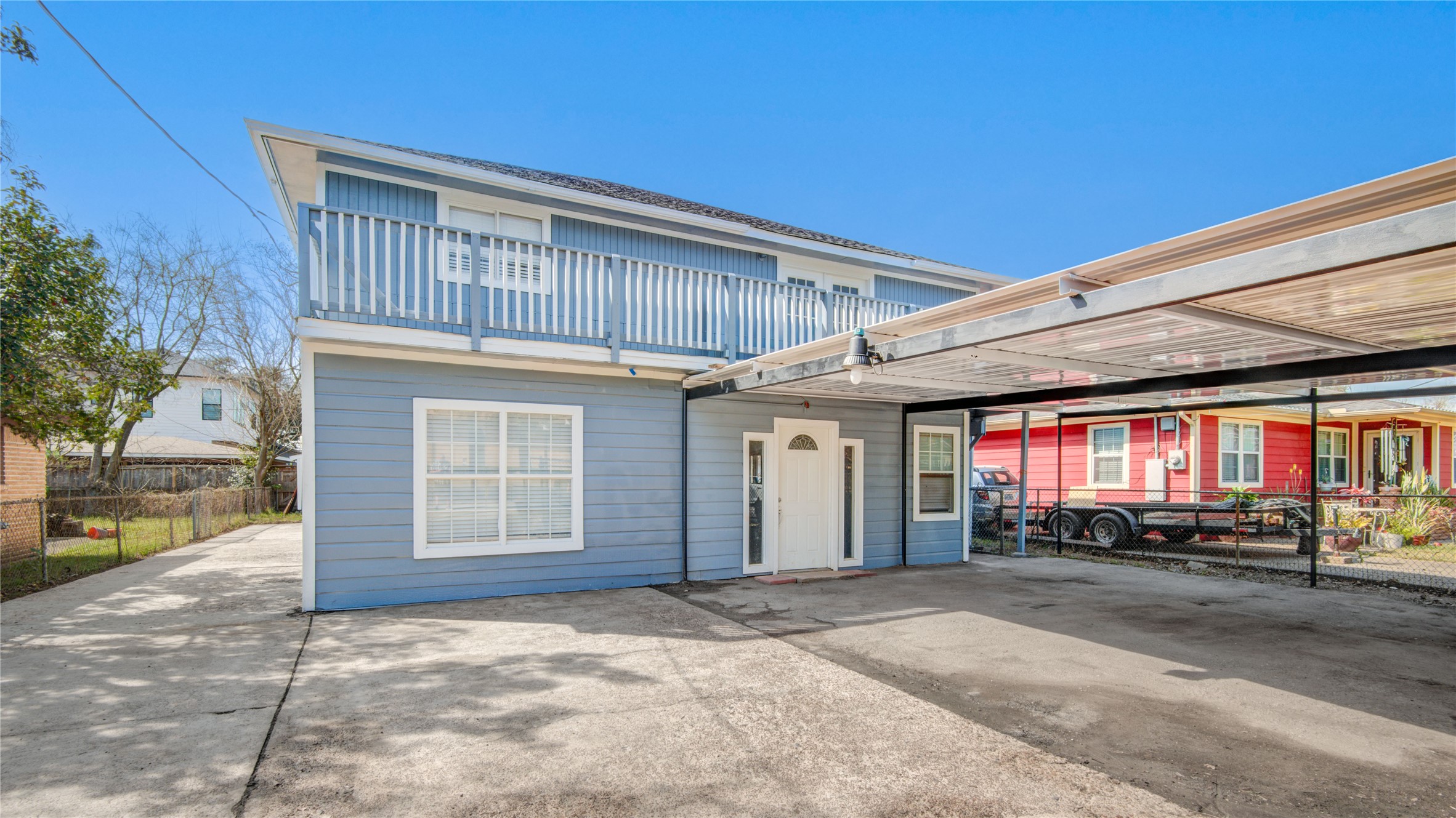 4909 Cochran Street, Unit 12 Houston, TX 77009 - Photo 22 of 29 a front view of a house with a yard and garage