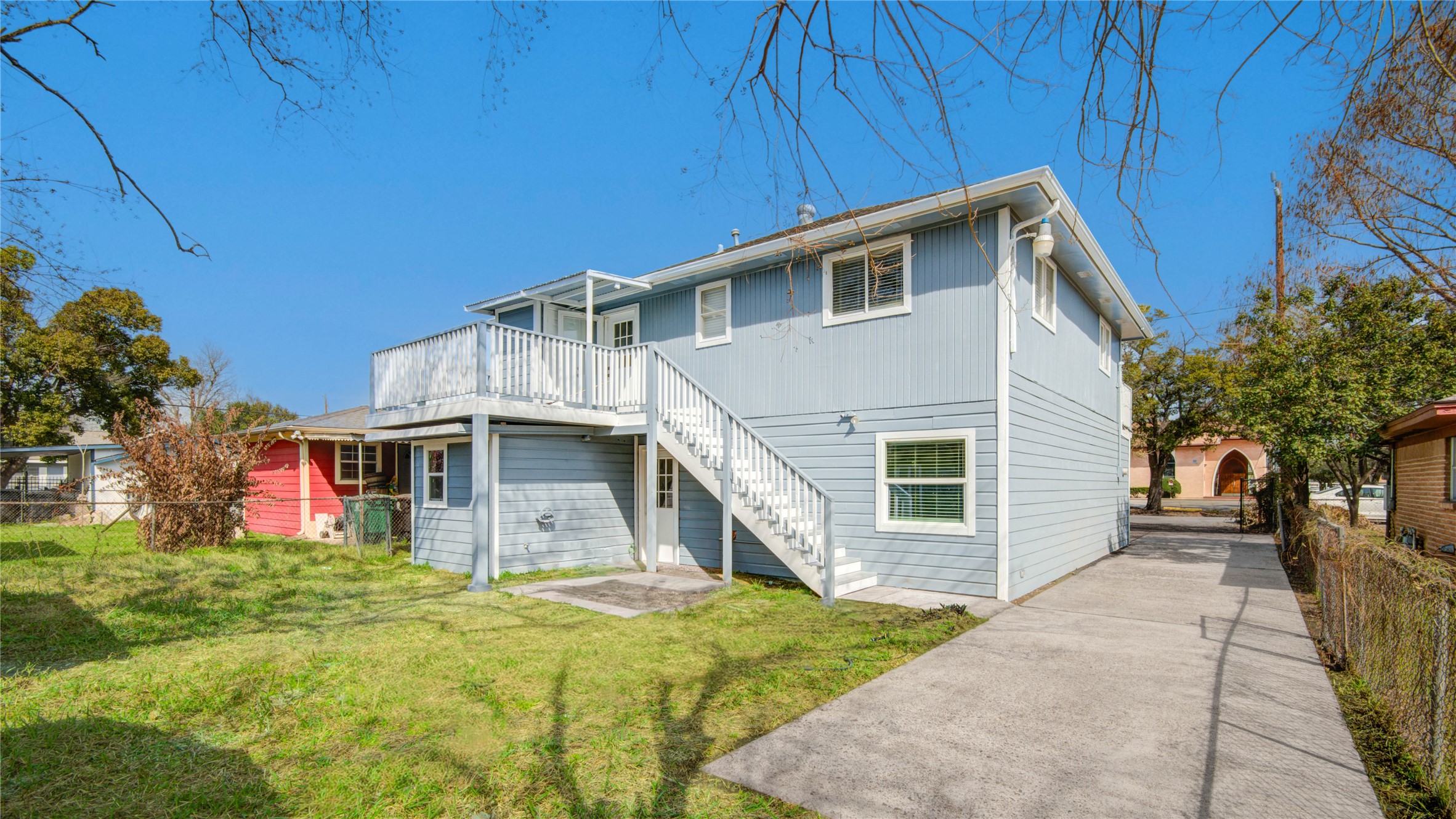 4909 Cochran Street, Unit 12 Houston, TX 77009 - Photo 24 of 29 a front view of a house with a yard