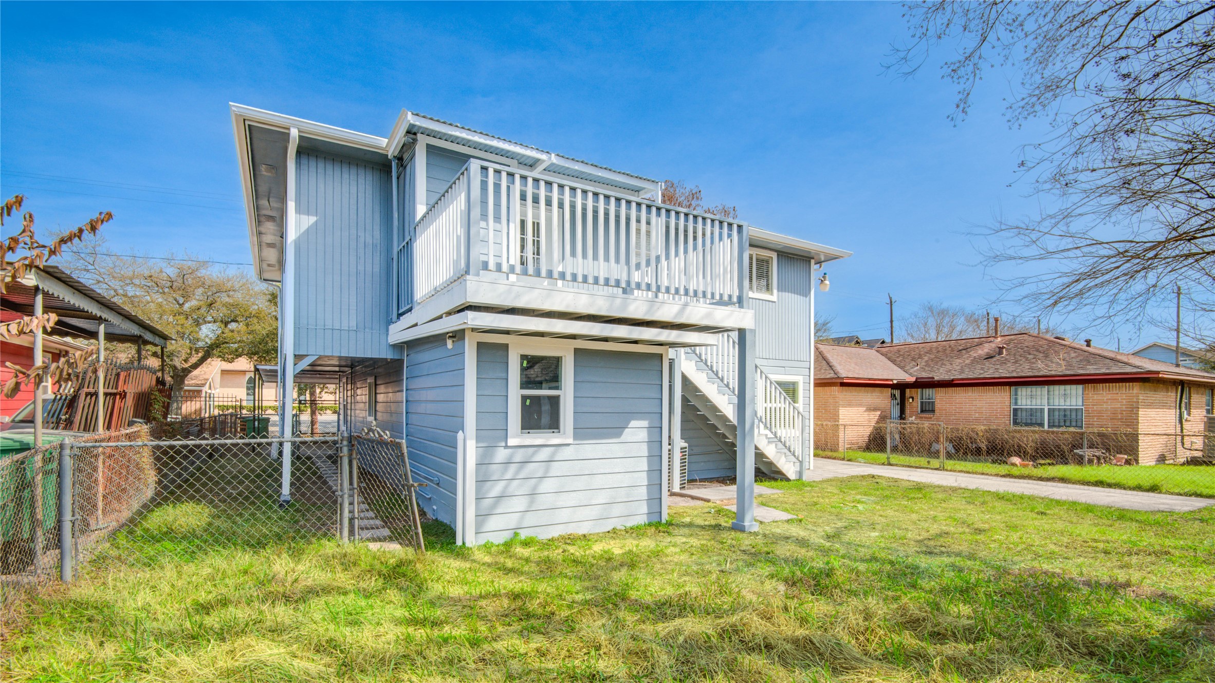 4909 Cochran Street, Unit 12 Houston, TX 77009 - Photo 25 of 29 a front view of a house with a yard