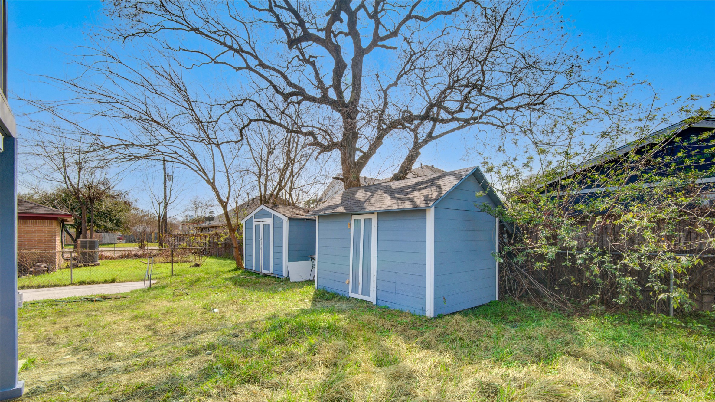 4909 Cochran Street, Unit 12 Houston, TX 77009 - Photo 26 of 29 a view of a house with a yard and tree s