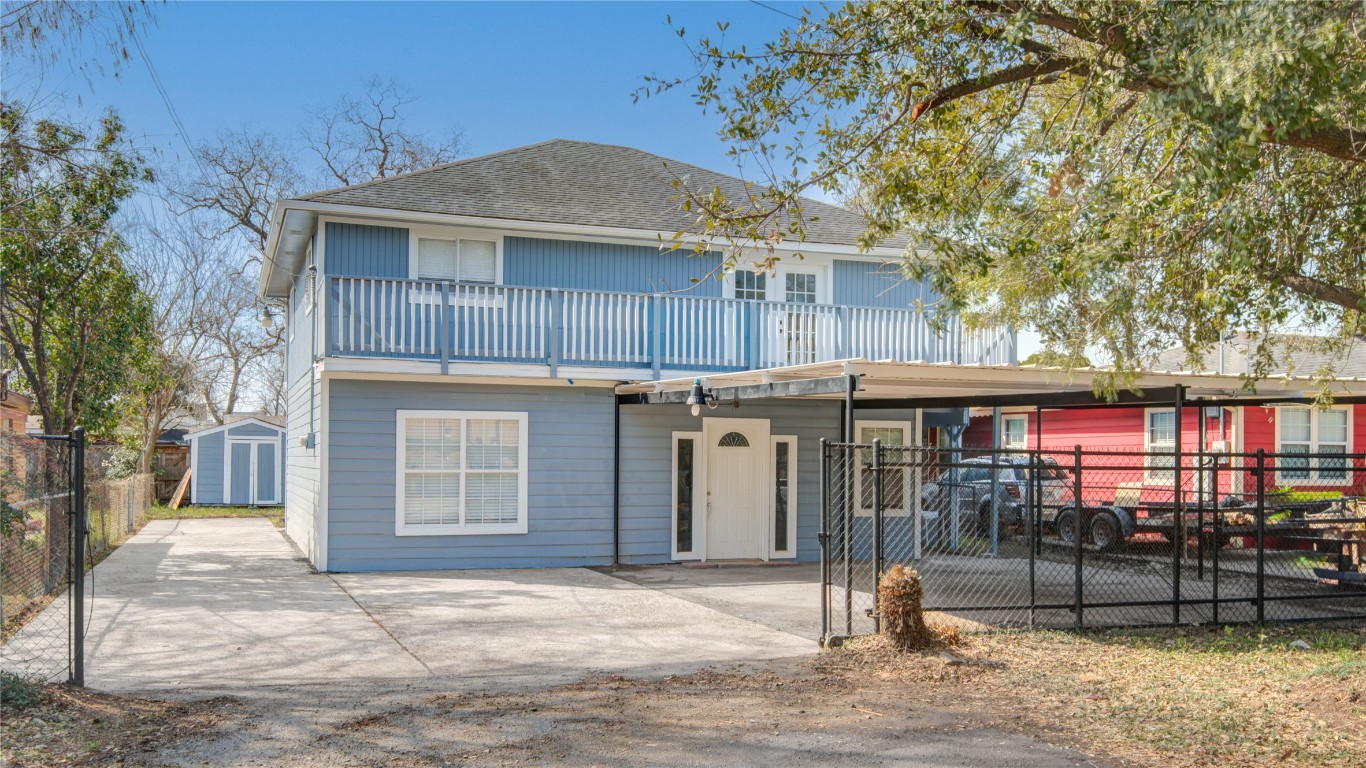 4909 Cochran Street, Unit 12 Houston, TX 77009 - Photo 28 of 29 a front view of a house with a yard
