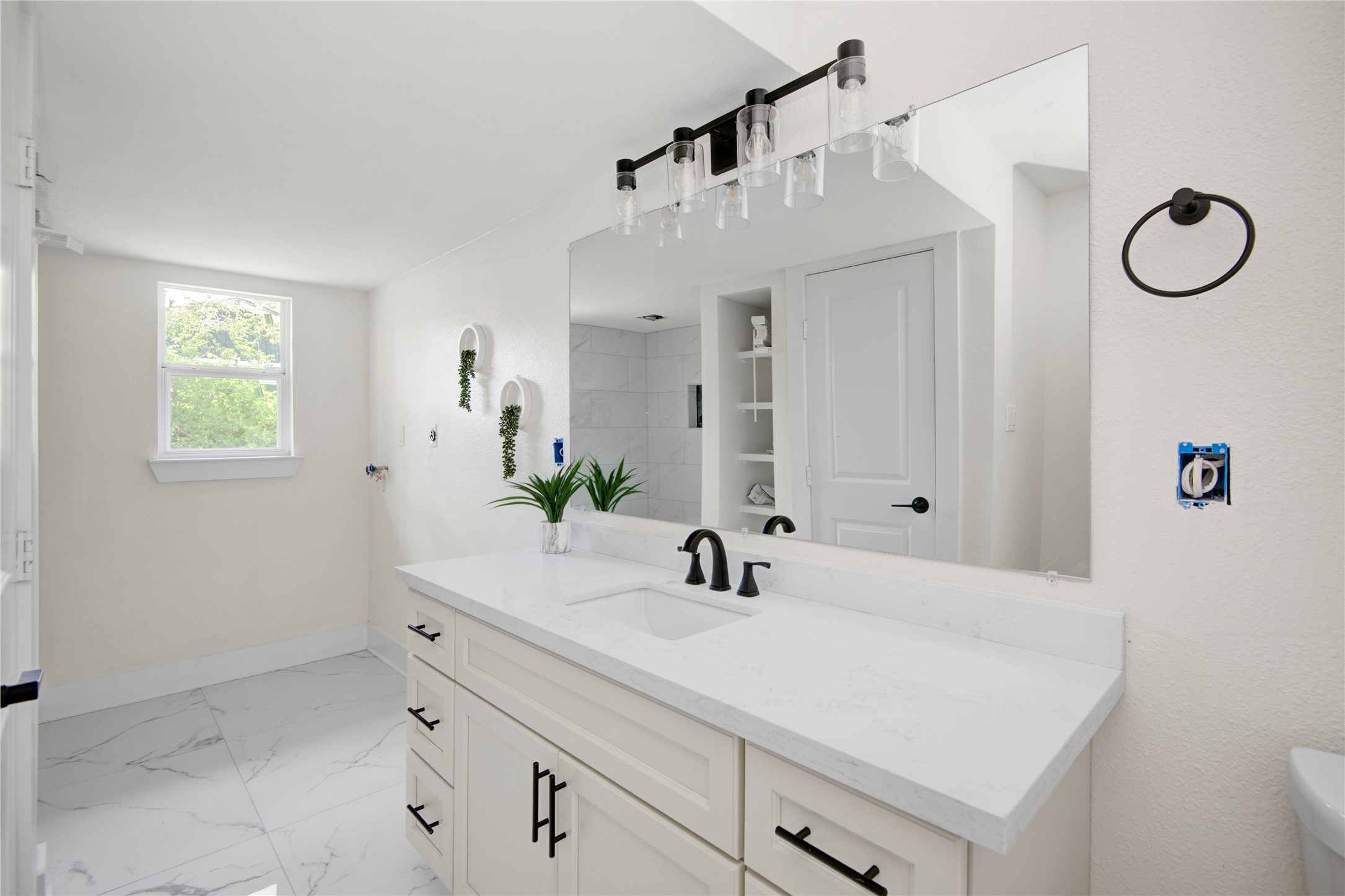 4909 Cochran Street, Unit 12 Houston, TX 77009 - Photo 4 of 29 a bathroom with a sink vanity and a mirror