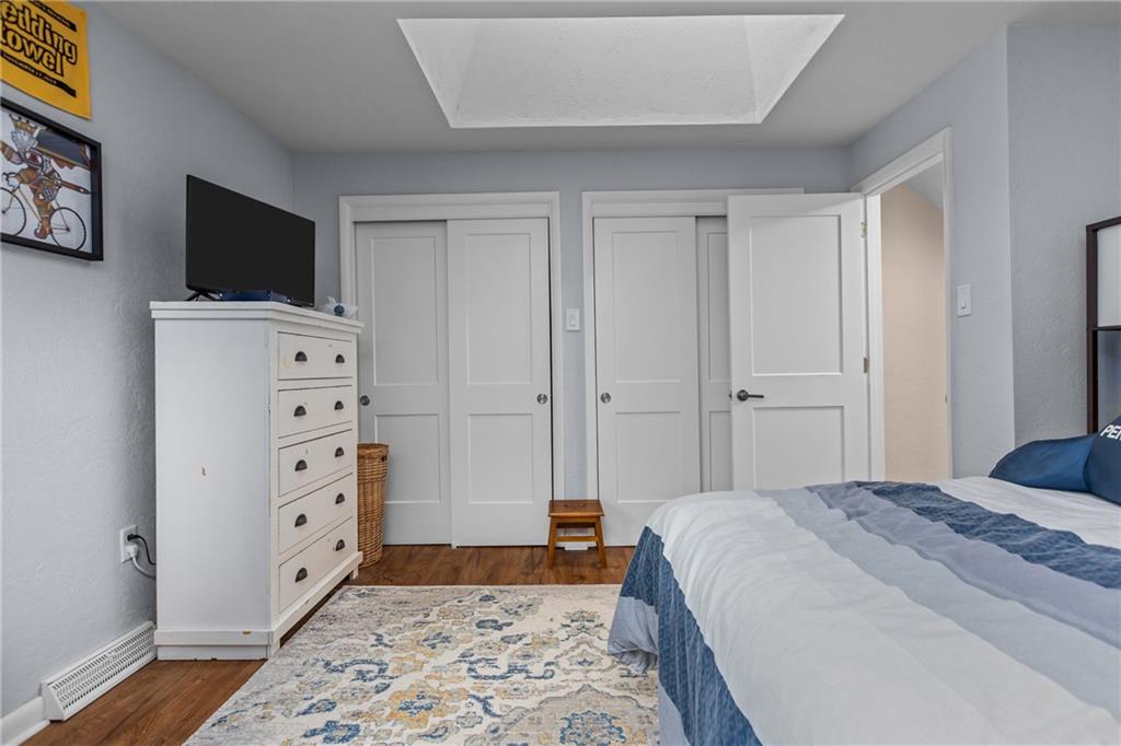 1104 West Ridge Road Allison Park, PA 15101 - Photo 17 of 32 a bedroom with a bed and a flat screen tv