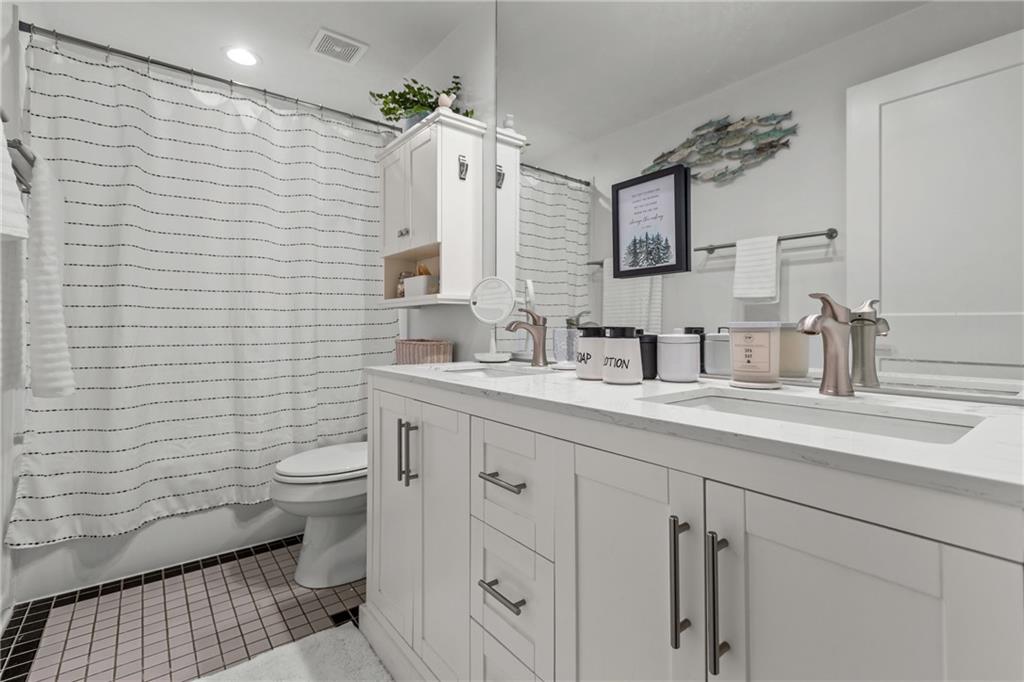 1104 West Ridge Road Allison Park, PA 15101 - Photo 20 of 32 a bathroom with a sink a toilet and mirror