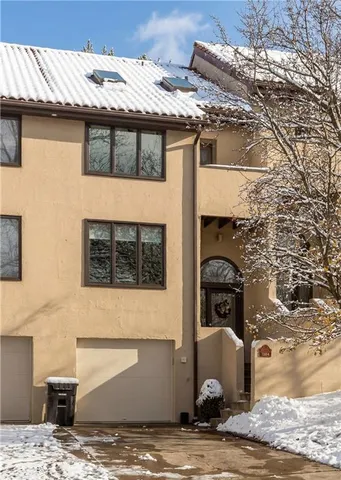 a front view of a house with parking