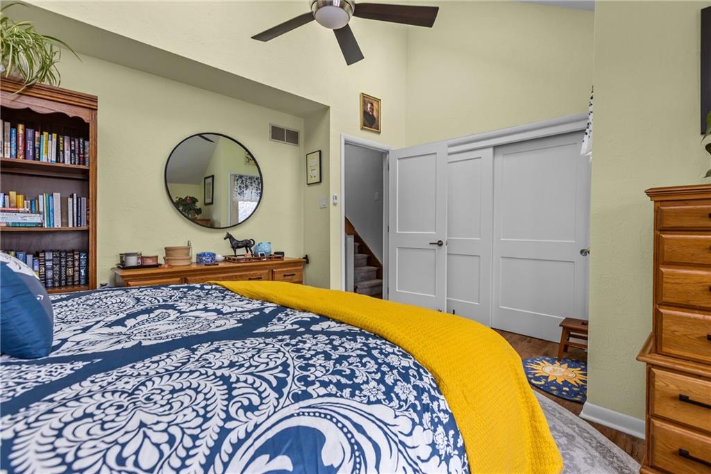 1104 West Ridge Road Allison Park, PA 15101 - Photo 22 of 32 a bedroom with a bed and a chandelier