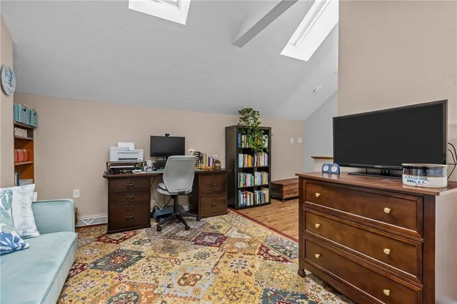 a room with a flat screen tv and a couch