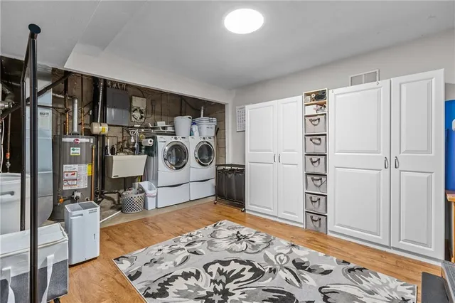 a view of a bedroom with bed and wooden floor