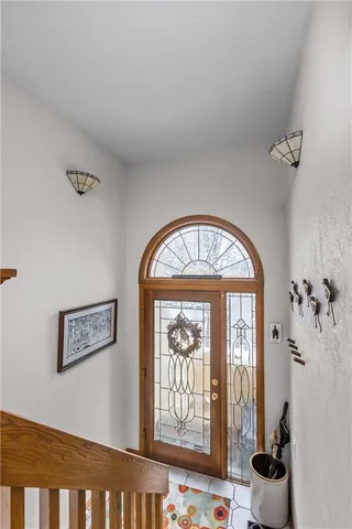 a view of an entryway with wooden floor