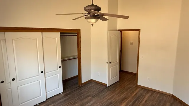 a view of hallway with wooden floor