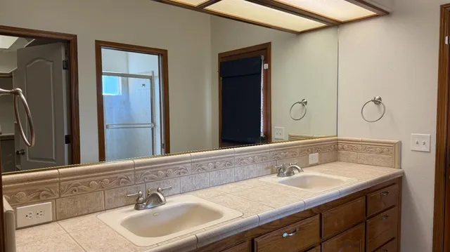 a bathroom with a sink and a mirror