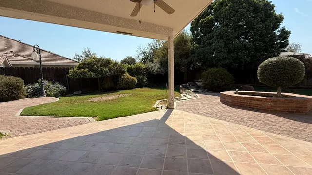 a view of backyard with a garden and entertaining space